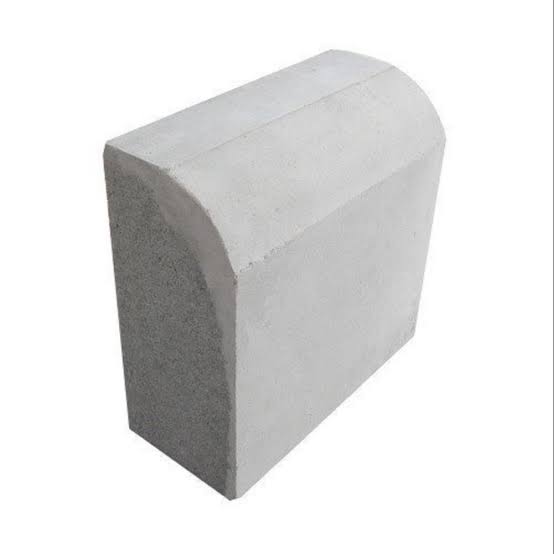 Grey kerb stone with rounded top